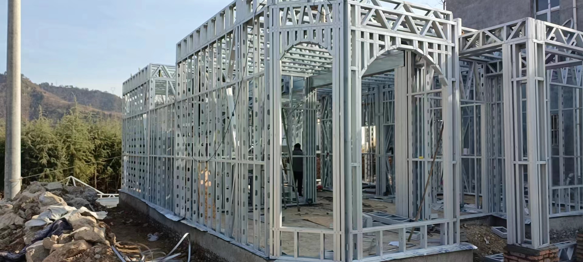 What material is used for the steel frame of a light steel villa?