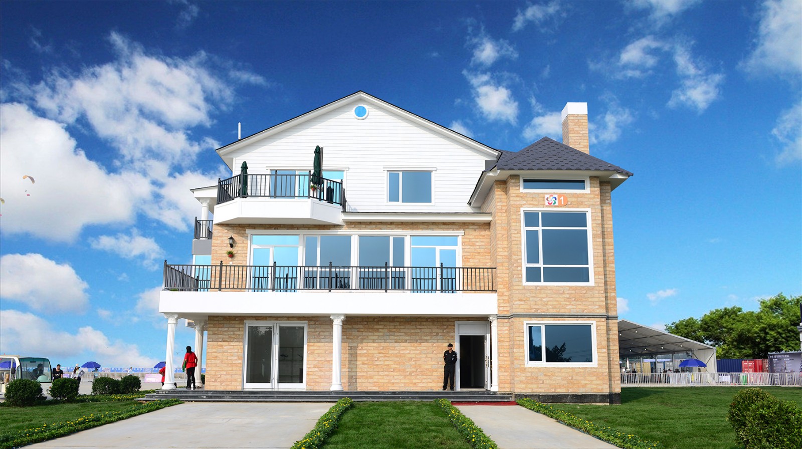 Light steel villa bathed in blue skies and white clouds